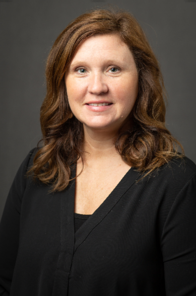 Brandi Asbill Woman in dark sweater