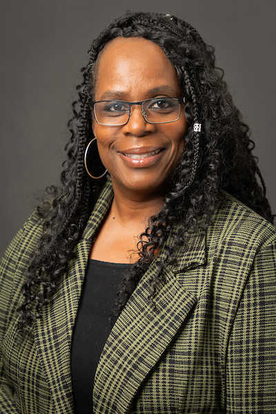 Jayne Collins McKinnie Woman in green jacket