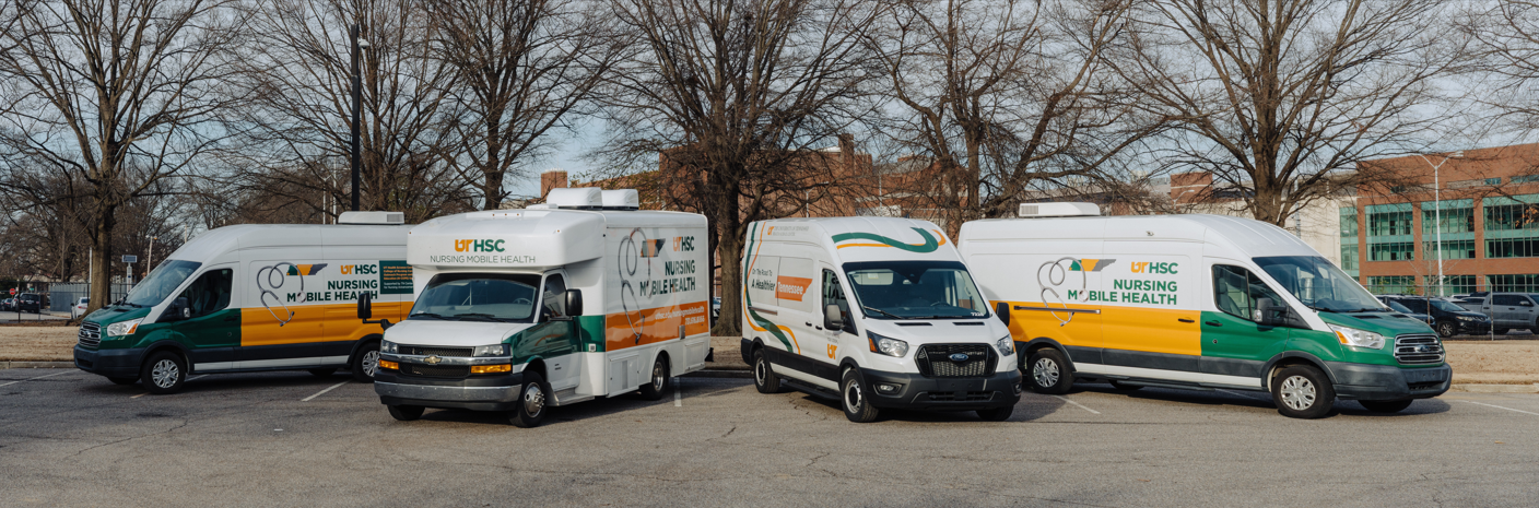 fleetforbanner four medical vans parked in front of trees